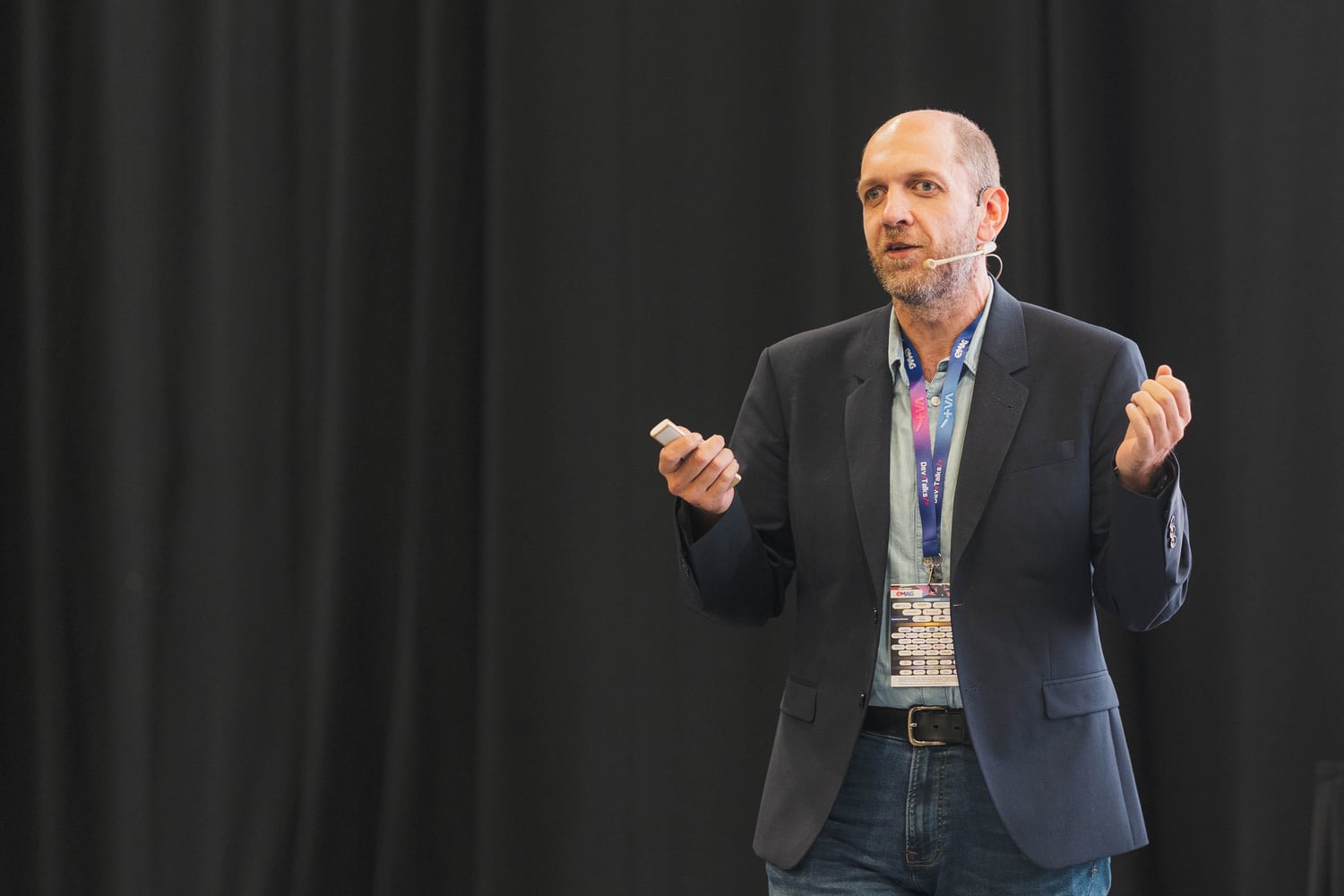 Dan Patrascu-Baba speaking on stage at DevTalks