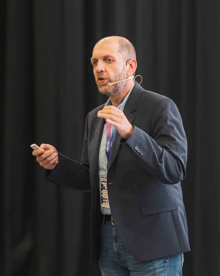 Dan Patrascu-Baba speaking on stage at DevTalks