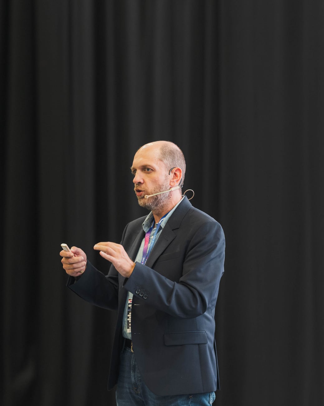 Dan Patrascu-Baba speaking on stage at DevTalks